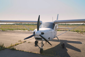 Fototapeta na wymiar Light single-engine aircraft at the airport