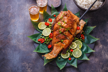 Thai style deep fried whole fish, copy space