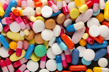 Fototapeta na wymiar Different pills as background