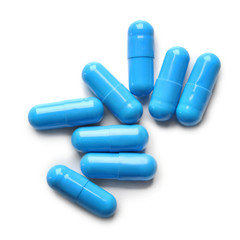 Colorful pills on white background