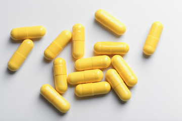 Colorful pills on white background