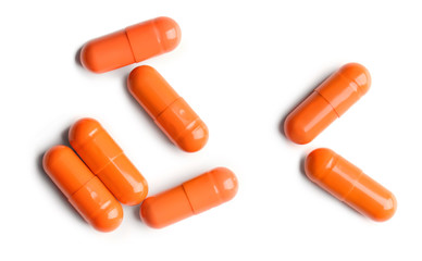 Colorful pills on white background