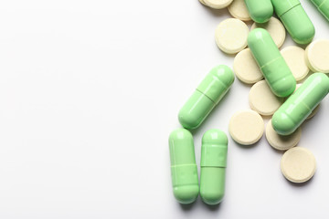 Colorful pills on white background