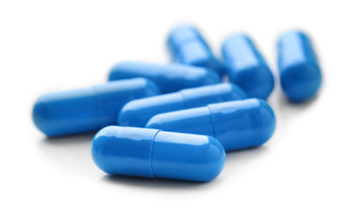 Colorful pills on white background