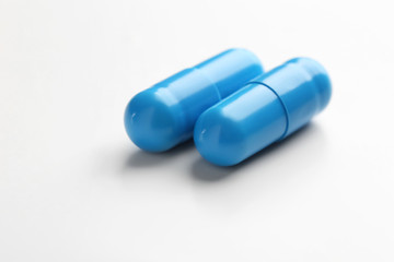 Colorful pills on white background