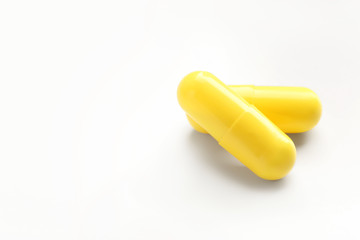 Colorful pills on white background