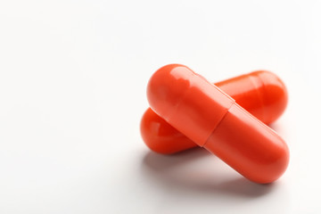 Colorful pills on white background