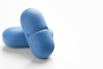 Colorful pills on white background