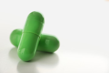 Colorful pills on white background