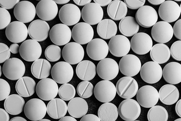 White pills on table, top view