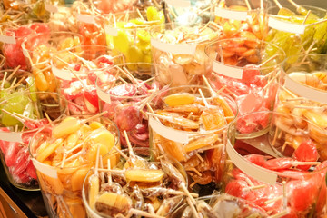 Different colorful candies in glasses, closeup