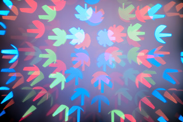 Blurred view of beautiful lights on dark background