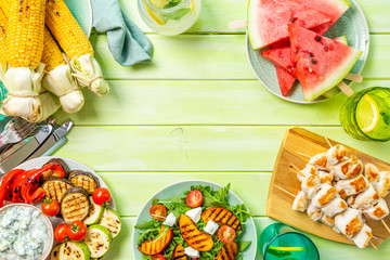 Summer bbq party concept - grilled chicken, vegetables, corn, salad, top view, copy space