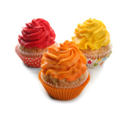 Colorful cupcakes on white background