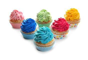 Colorful cupcakes on white background