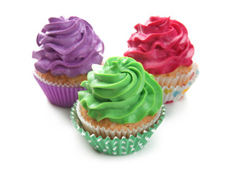 Colorful cupcakes on white background