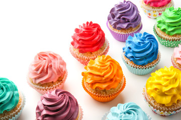 Colorful cupcakes on white background
