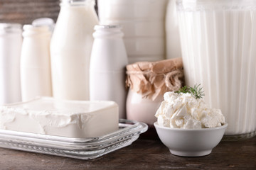 Different milk products on wooden table