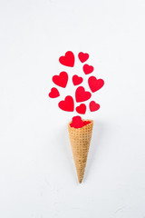 Ice Cream or Cone with Red Hearts on white Background. Top View. Love or Valentine's Day Concept. Top view, flat lay