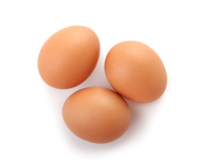 Raw chicken eggs on white background