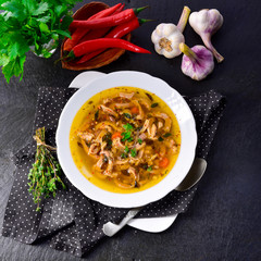 Traditional tripe soup in polish style with beef and vegetables