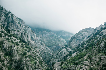 Beautiful view of the mountains in the fog in Montenegro. Natural landscape.