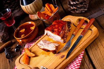 spicy roasted meat with mushroom sauce in the oven