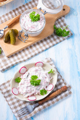 delicious homemade meat salad with mayonnaise and cucumber
