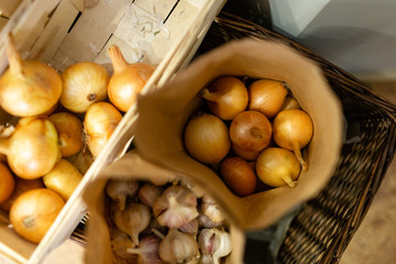 Natural fresh onions packed in paper bags. Top view image.