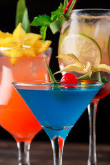 Multicolored cocktails at the bar close up shot