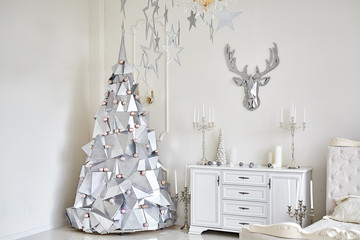 Christmas tree made of alternative material and festive decor for Christmas