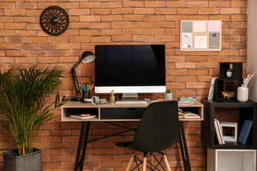 Modern workplace of designer in interior of room