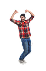 Handsome young man dancing on white background