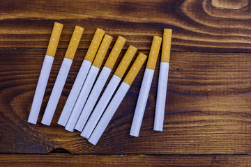 Tobacco cigarettes on wooden table