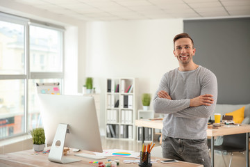 Portrait of young designer in office