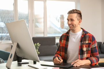 Young designer working in office