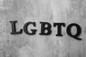 Abbreviation LGBTQ on grey background