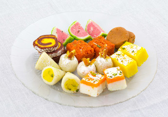 Indian Traditional Mix Sweet Food or Mix Mithai include Peda, Mawa Burfi, Dry Fruits Sweet, Halwa or Coconut Burfi