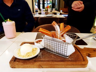 Eating dessert food with vanilla ice cream, sweet bread on wooden board and strawberry smoothies after lunch with waiter or waitress and customer background at coffee café - Food, Business, Service   