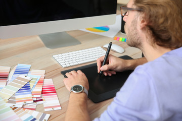 Young designer working in studio