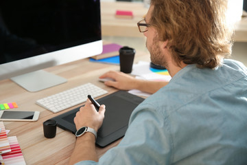 Young designer working in studio