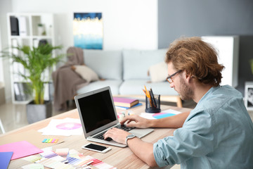 Young designer working in studio
