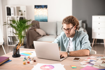 Young designer working in studio