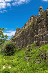 Fototapeta na wymiar Fragment of the wall of the ancient fortress