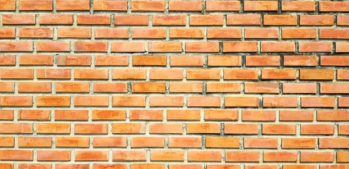 Obraz premium Brown brick wall for background - Construction, Wallpaper and Seamless pattern concept 