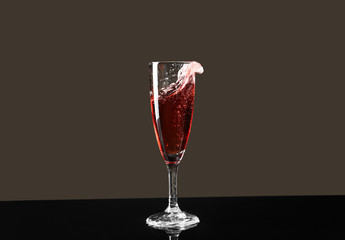 Glass of champagne on dark background