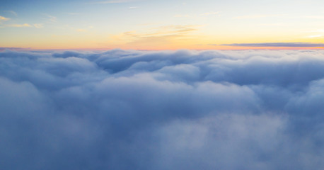 Fototapeta premium Beautiful sunrise cloudy sky from aerial view