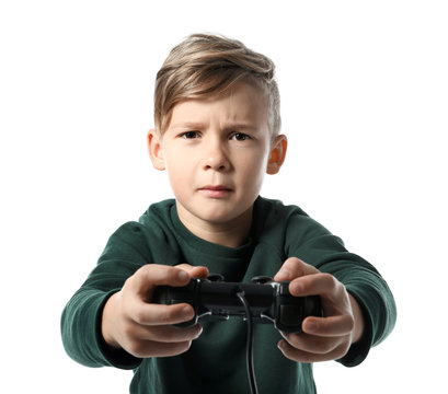 Emotional boy playing video game on white background