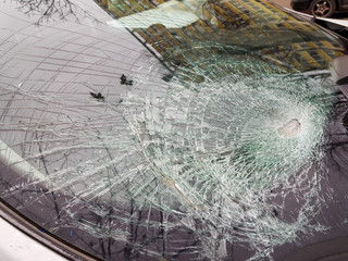 Broken car windshield after a crash