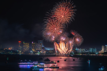 Fireworks international colorful Pattaya beach cityscape at night scene for advertise traveling event holiday., Pattaya city